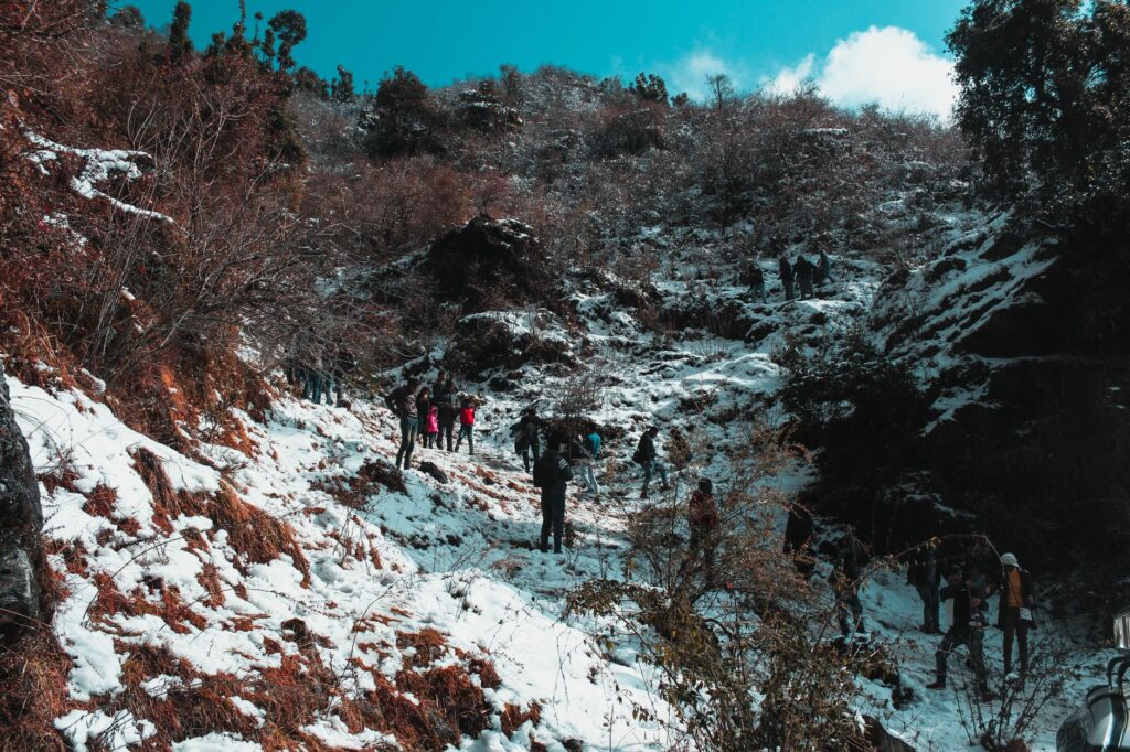 Trekkers walking toward snow-capped Himalayan peaks during the best time to visit Nepal
