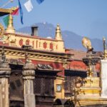 Nepal's unique non-rectangular flag flying against the Himalayan mountains, representing things only Nepal has